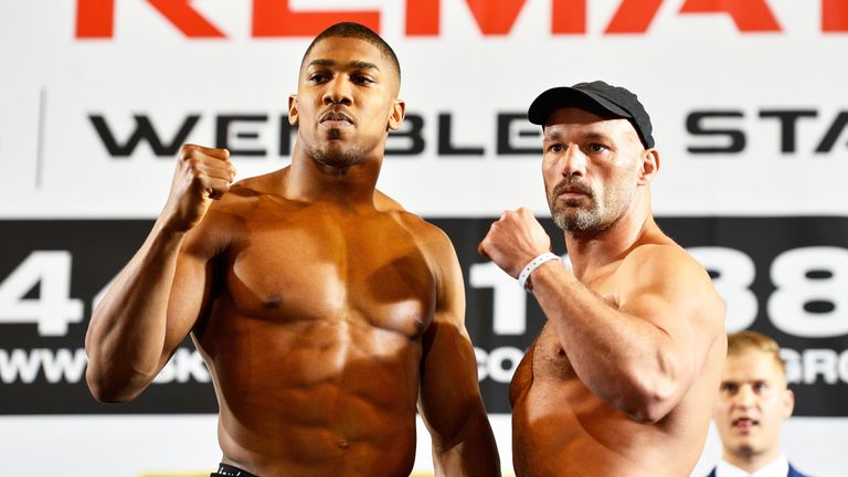 Joshua and Legg hit the scales in front of a large crowd at the weigh-in