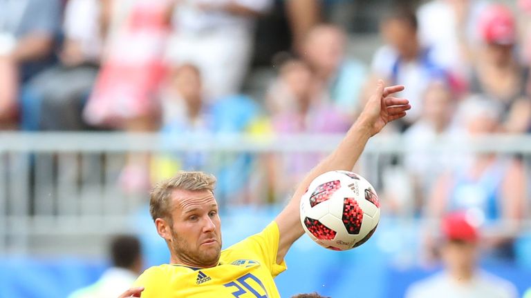 Ola Toivonen challenges Alli in the first half