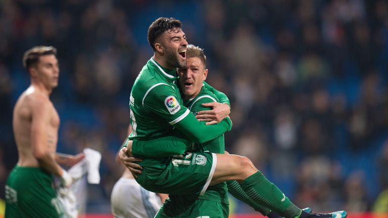 Diego Rico (left) of CD Leganes celebrates with Raul Garcia after they beat Real Madrid in the Copa del Rey