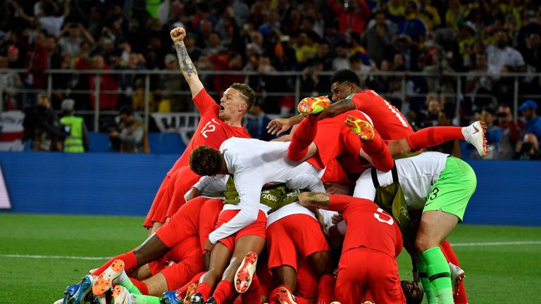 England's players celebrate winning the penalty shootout against Colombia in the last 16