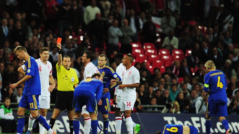Cakir shows a red card to Steven Gerrard