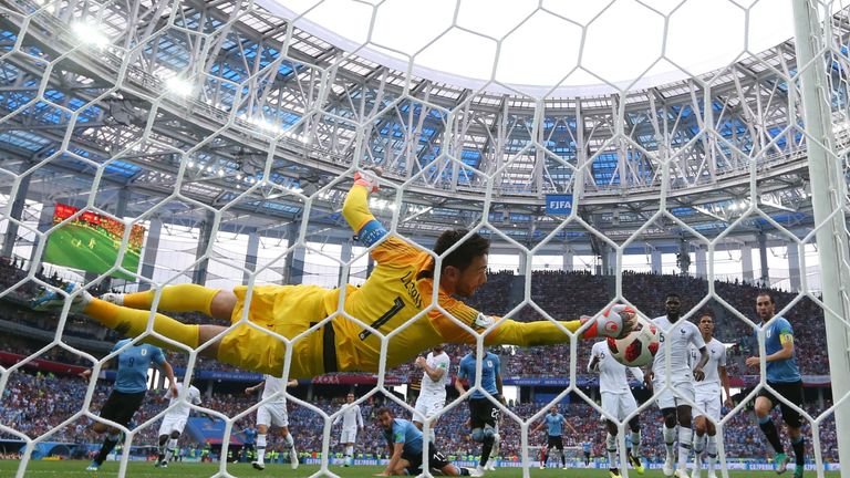 Hugo Lloris saves from a Martin Caceres header