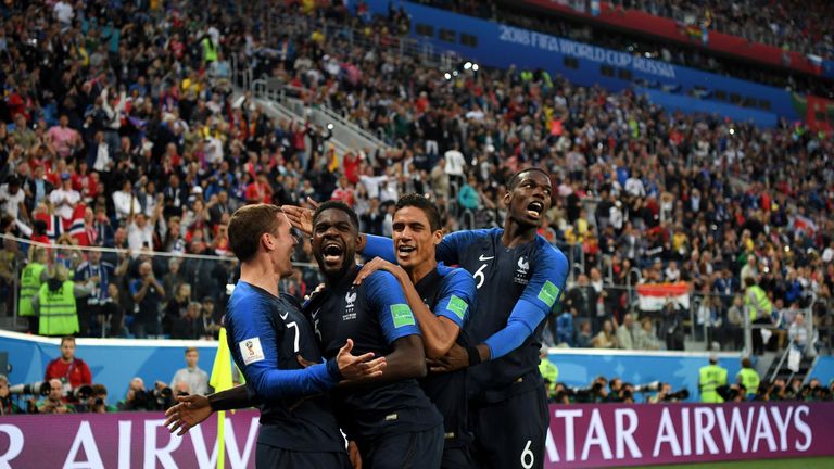 Antoine Griezmann celebrates with Samuel Umtiti after setting him up for France's winning goal