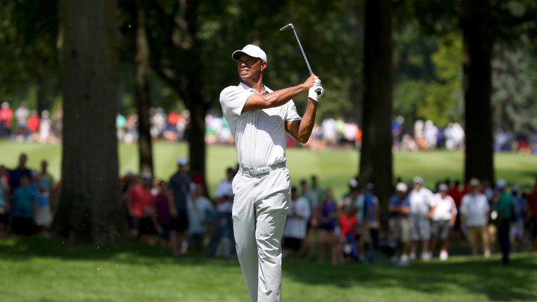 Tiger Woods made only one birdie as he slid 11 shots behind