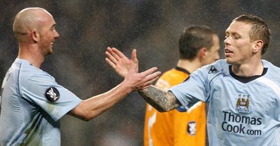 Shake on it: Goalscorer Bellamy takes the plaudits