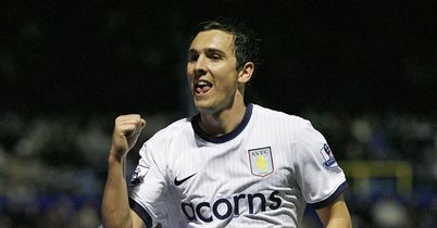 Stewart Downing scores on his first start for Aston Villa to book a place in the Carling Cup semi-finals.
