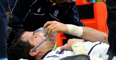 Rory Lamont receives oxygen after falling awkwardly at Murrayfield