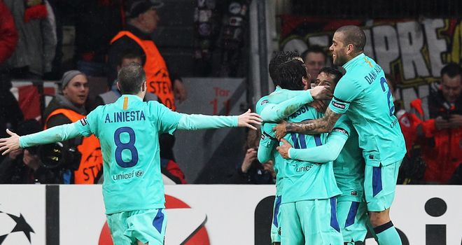 Barcelona players celebrate the opening goal from Alexi Sanchez, his first in the Champions League