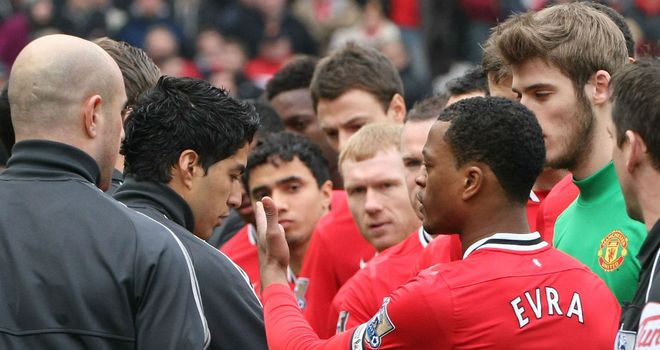 Clarke Carlisle hopes Luis Suarez and Patrice Evra can be brought together to resolve differences