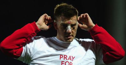 Sunderland striker Nicklas Bendtner wears a 'Pray for Muamba' T-shirt before the game at Blackburn.