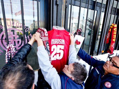 Image of Tributes to Piermario Morosini were placed by supporters at the main gates of Livorno's Armando Picchi stadium