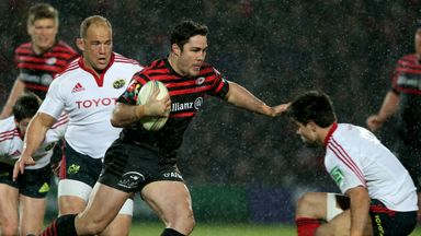 Brad Barritt of Saracens steps inside Conor Murray of Munster