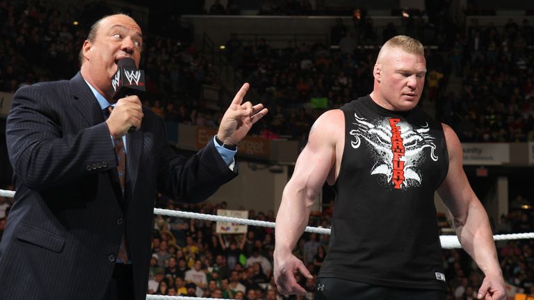 Paul Heyman (L) manages a Beast in Brock Lesnar 
