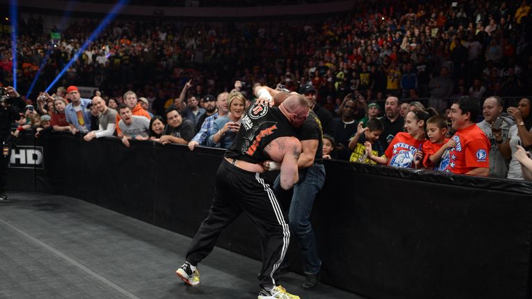 Best of enemies: Lesnar (L) and Triple H will go to war again at WrestleMania