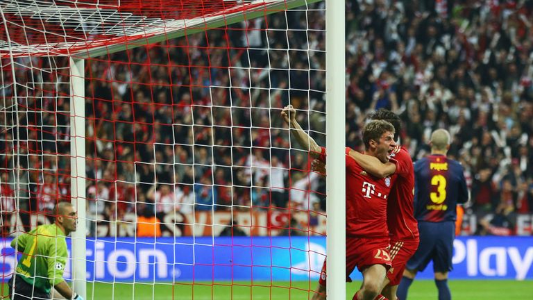 Thomas Muller celebrates scoring against Barcelona at the Allianz Arena in 2013