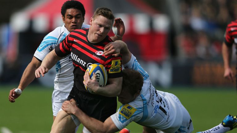 Chris Ashton of Saracens is tackled by Chris Pennel