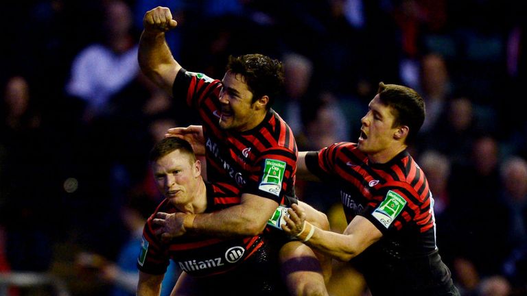 Try-scorer Chris Ashton is congratulated by Brad Barritt and Joel Tomkins