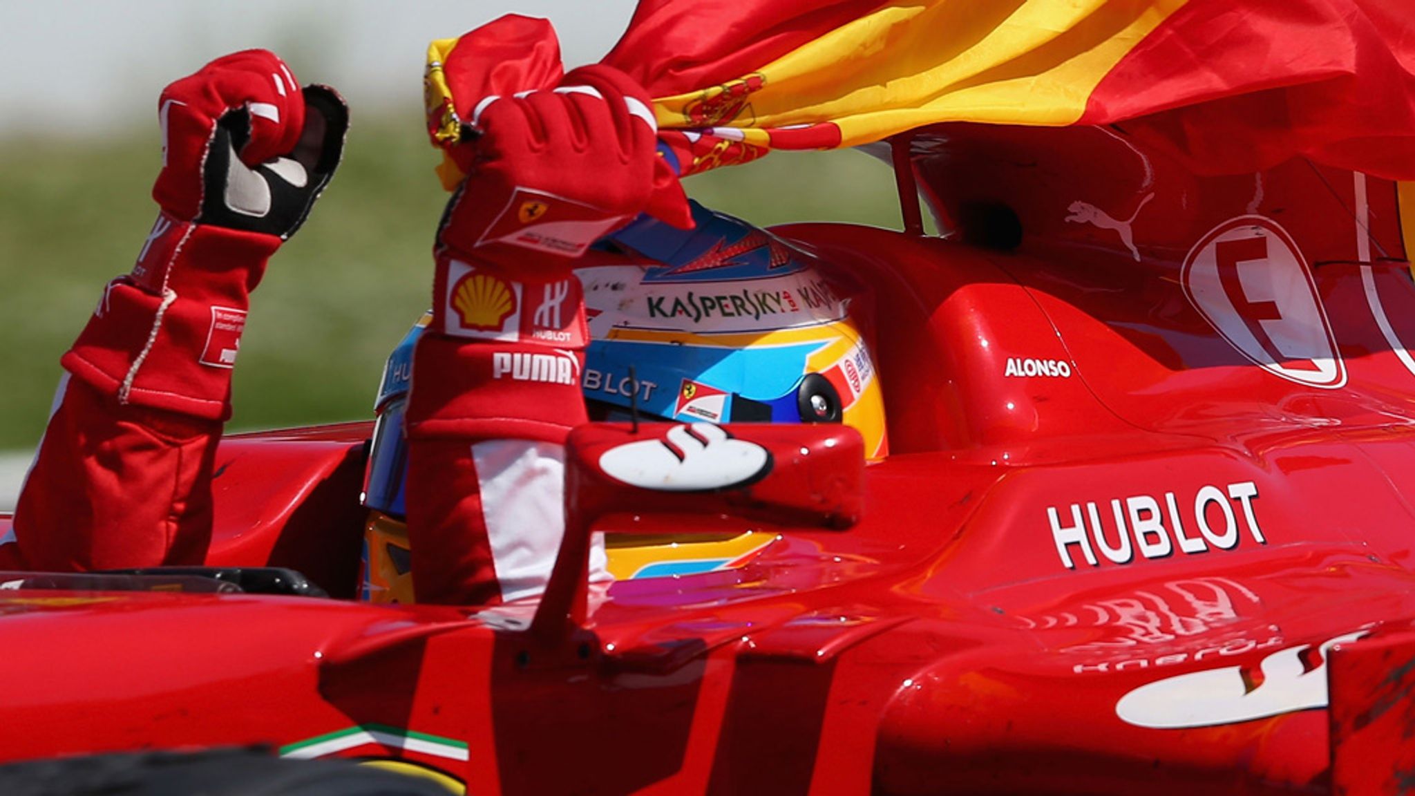 Fernando Alonso avoids punishment for collecting Spanish flag on