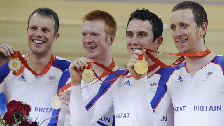 Sir Bradley Wiggins, right, celebrating winning one of two gold medals at the 2008 Olympic Games
