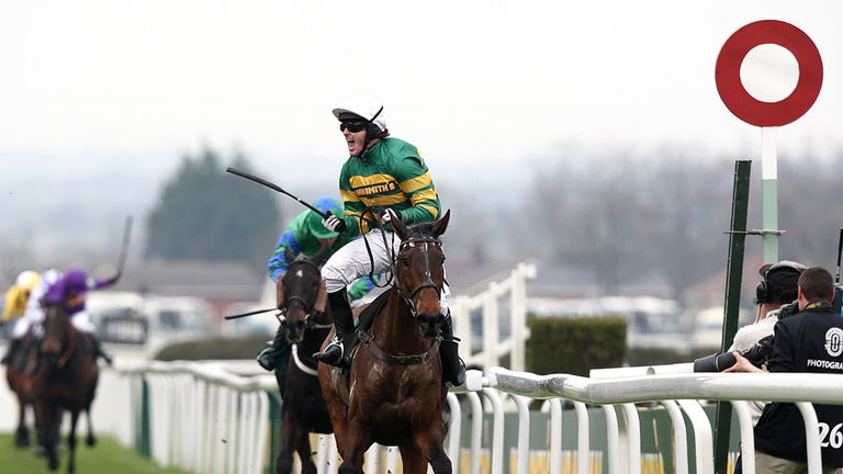 Tony McCoy salutes the crowd after winning the Grand National