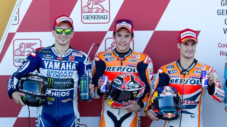 Marc Marquez (centre), Jorge Lorenzo (left) and Dani Pedrosa (right) after qualifying