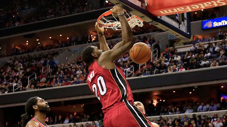 Greg Oden dunks during his first NBA game for four years
