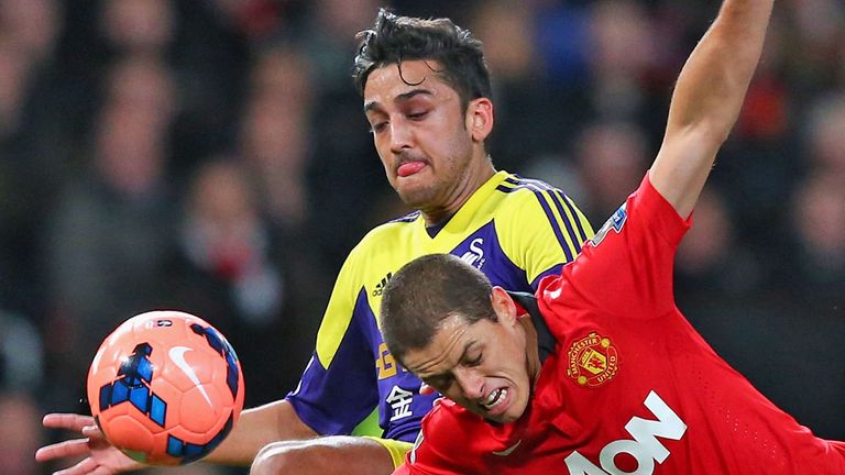 Neil Taylor: In action against Manchester United's Javier Hernandez