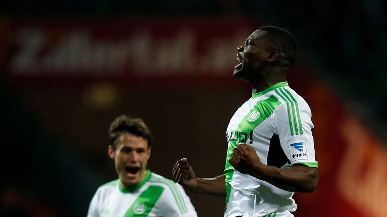 Junior Malanda of Wolfsburg celebrates after scoring his team's first goal