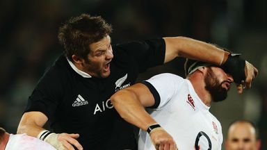 Tom Wood is taken out by New Zealand skipper Richie McCaw during the second Test in Dunedin