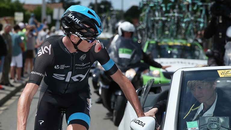 Chris Froome receives medical treatment following his crash on stage four