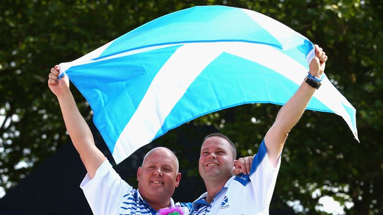 Alex Marshall and Paul Foster clebrate winning lawn bowls gold for Scotland