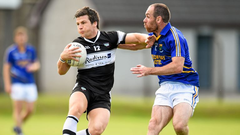 Sligo forward Brendan Egan is tackled by Patrick McWalter