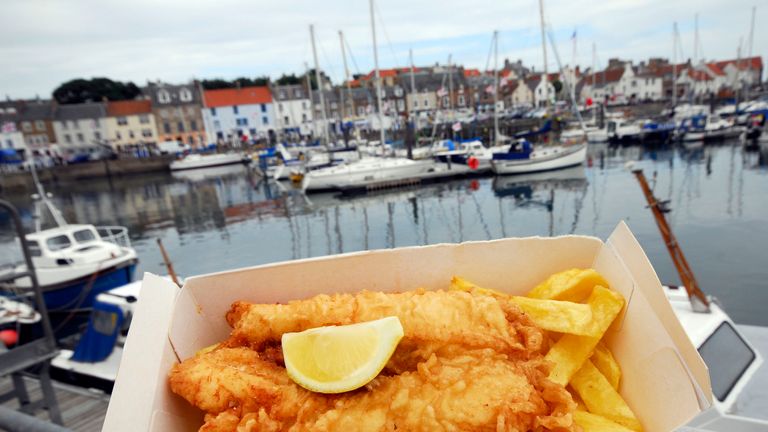 Fish 'n' chips from the Anstruther Fish Bar pictured by the harbour, Anstruther, East Neuk of Fife.