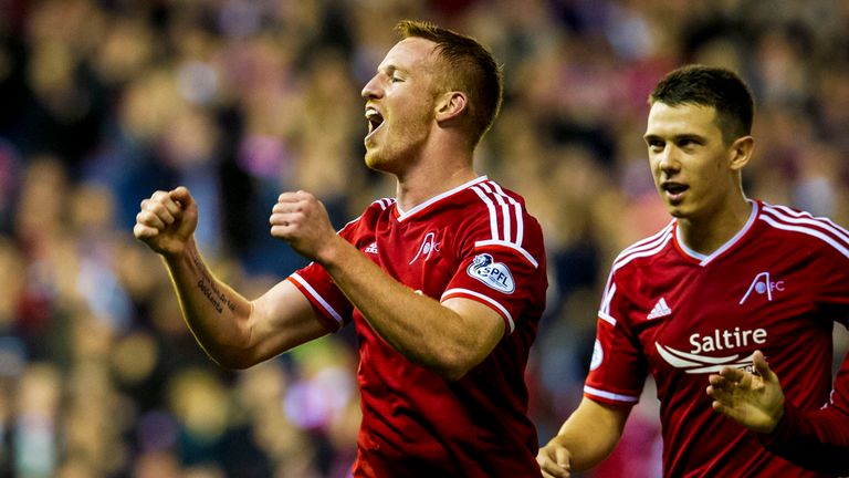 Adam Rooney celebrates after scoring against Livingston