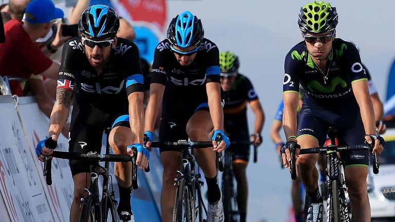 Sir Bradley Wiggins, left, crossed the line 14 seconds down on the winner in fifth