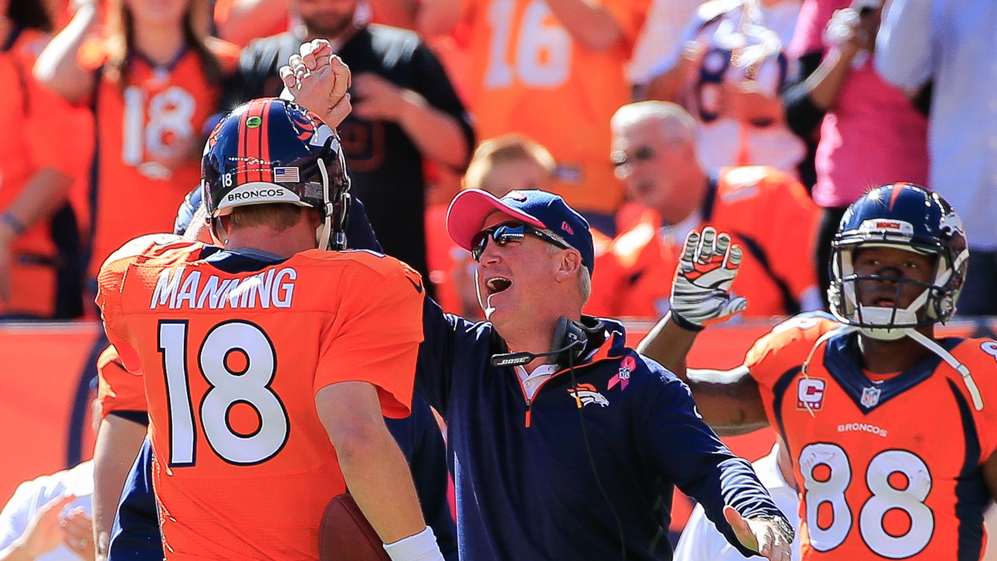 Denver Broncos quarterback Peyton Manning celebrates his 22-yard