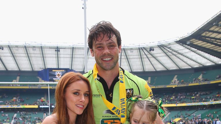 Una Foden poses with her husband Ben Foden of Northampton Saints with Aviva Premiership trophy