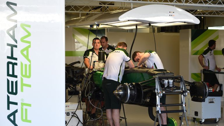Caterham mechanics at work on the team's return in Abu Dhabi