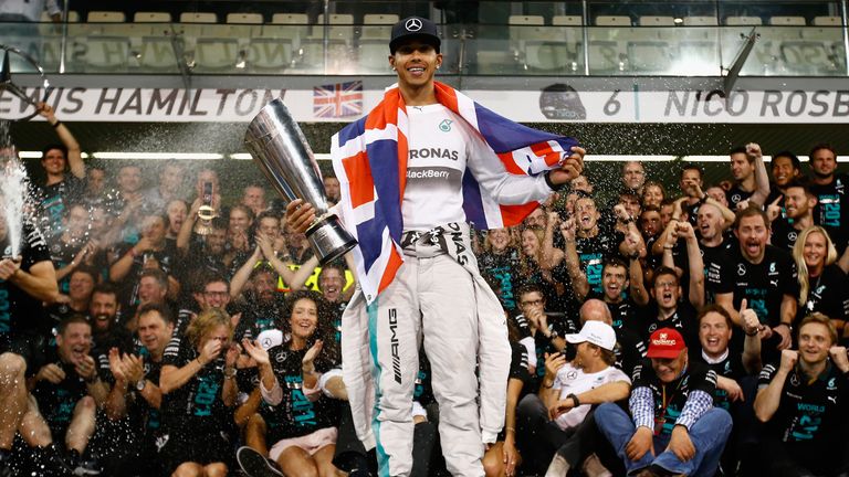 Lewis Hamilton of Great Britain and Mercedes celebrates with his team after winning the World Championship