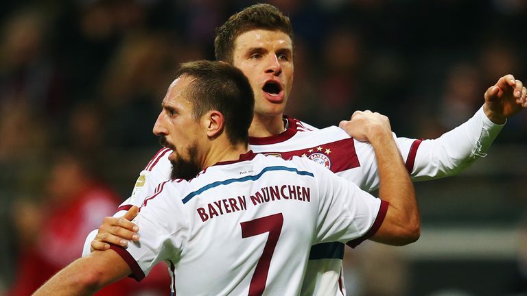 Hat-trick hero Thomas Mueller celebrates with Franck Ribery