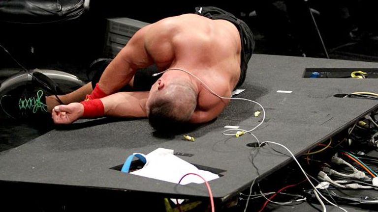 John Cena was left sprawled on the destroyed announce desk at the end of Raw