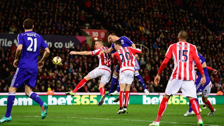 John Terry gets above Geoff Cameron and Ryan Shawcross to head in Chelsea's opener at Stoke