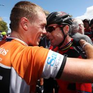 Rohan Dennis, left, is congratulated on his Tour Down Under victory by team-mate Cadel Evans