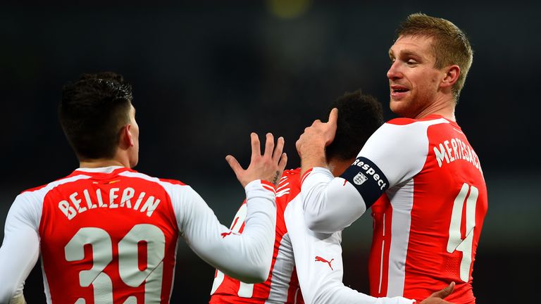 Mertesacker: Celebrates with team-mates