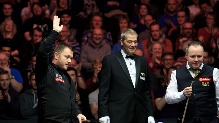Mark Allen waves to the crowd after escaping a snooker at the third attempt against John Higgins