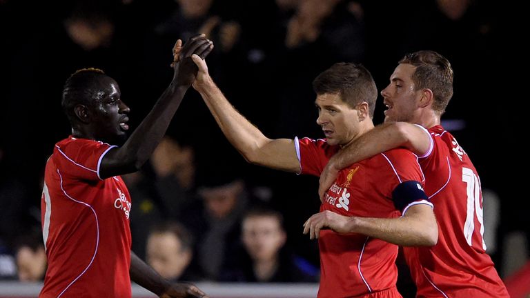 Gerrard celebrates his second of the game with team-mates