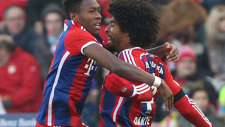 Bayern Munich's David Alaba (l) celebrates with Dante