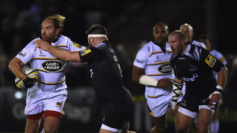 Wasps fly-half Andy Goode holds off Kieran Brookes