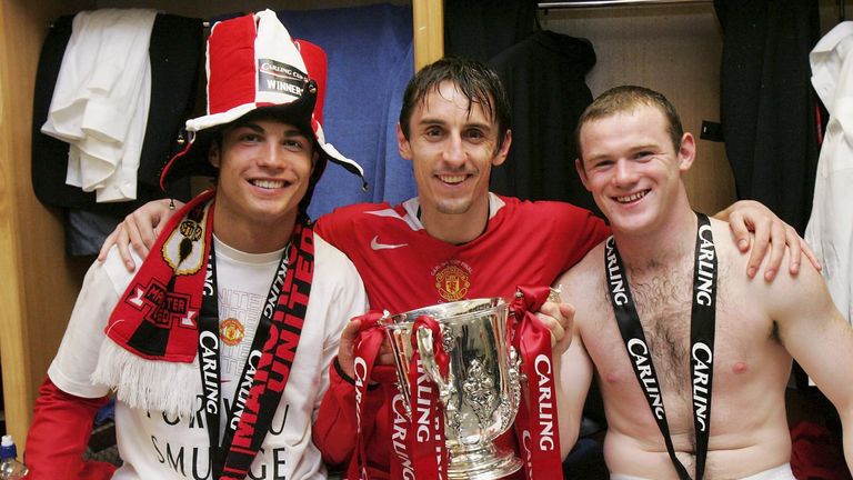 Rooney, Gary Neville and Cristiano Ronaldo pose with the League Cup after United's 2006 triumph