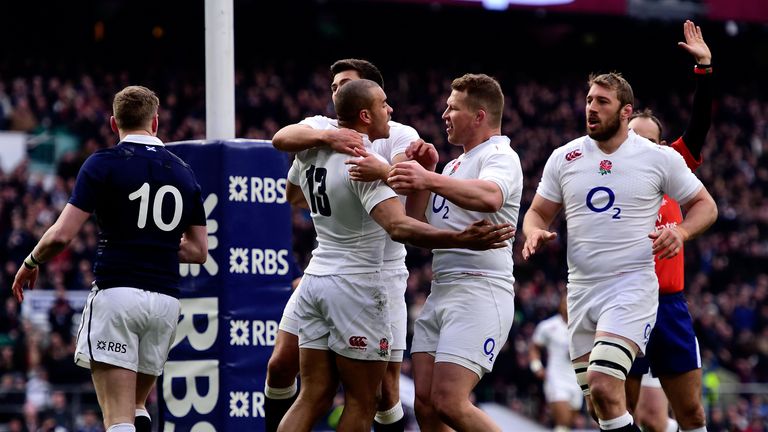 Jonathan Joseph of England celebrates after scoring England's first try